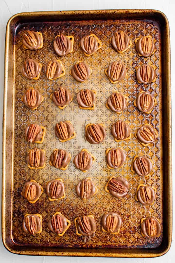Pecans pressed into rolos after baking.