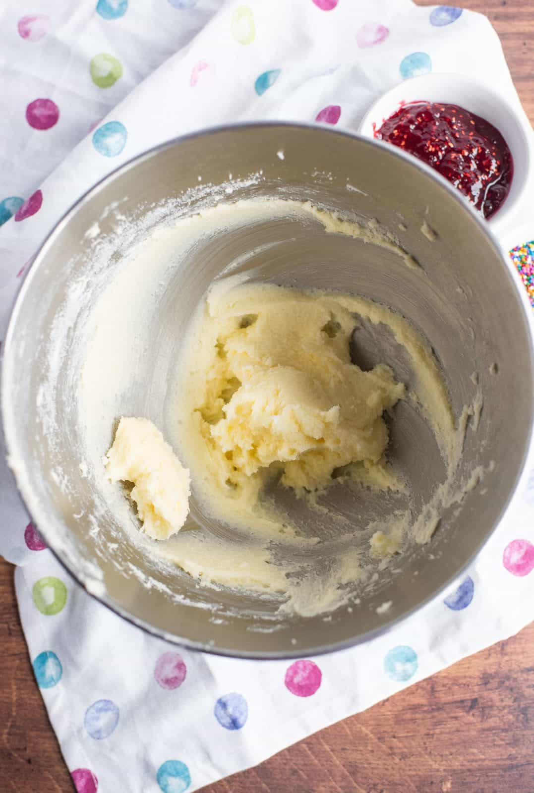 Butter and sugar beaten together in bowl of stand mixer.