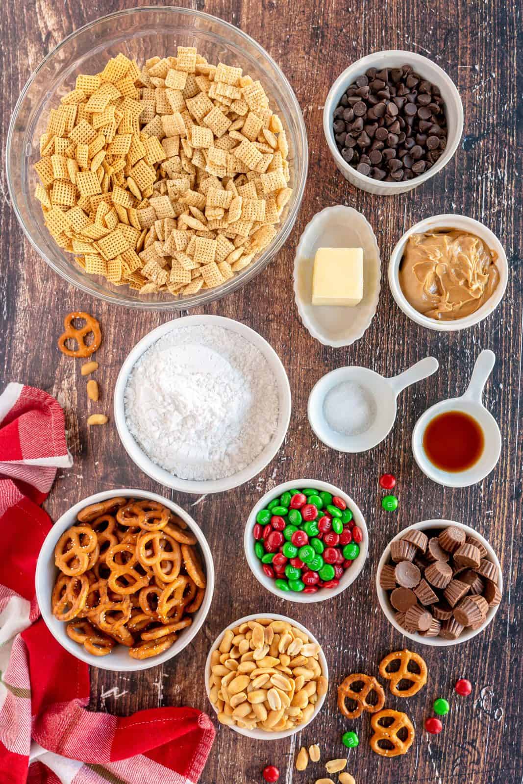 Ingredients needed: corn chex, rice chex, semi-sweet chocolate chips, peanut butter, salted butter, vanilla, salt, powdered sugar, Christmas M&Ms, pretzels, salted peanuts and Reese's Mini Peanut Butter Cups.