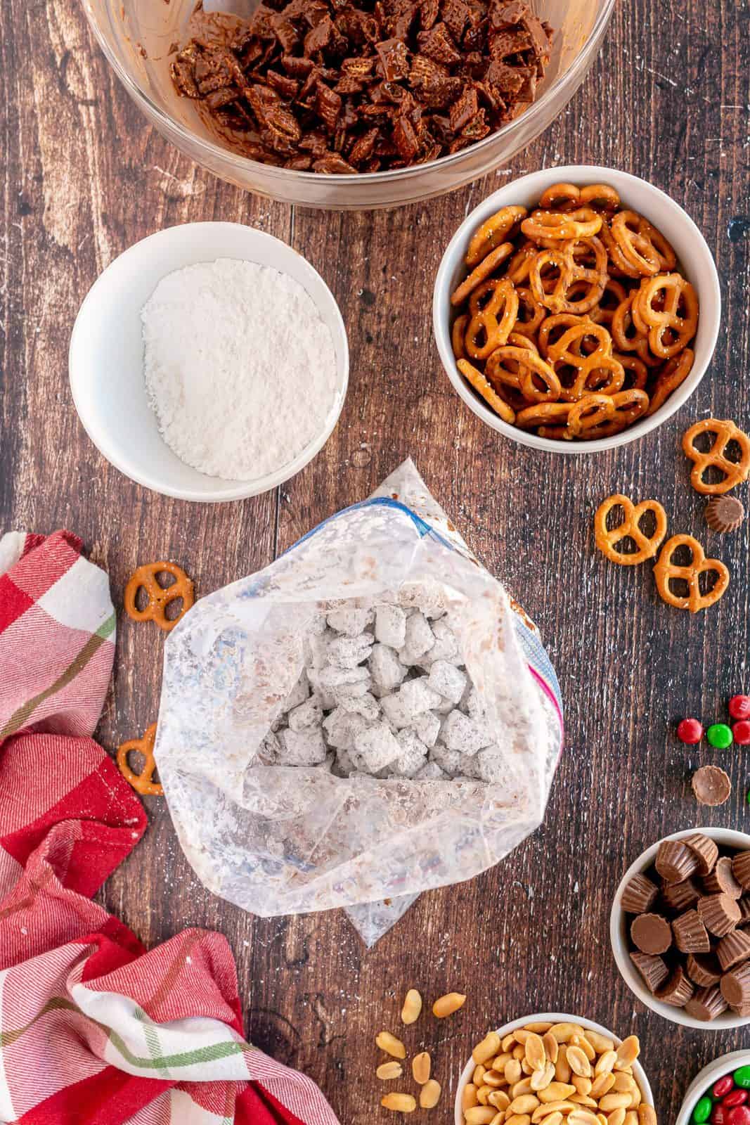 Cereal mixture in ziptop bag mixed with powdered sugar.