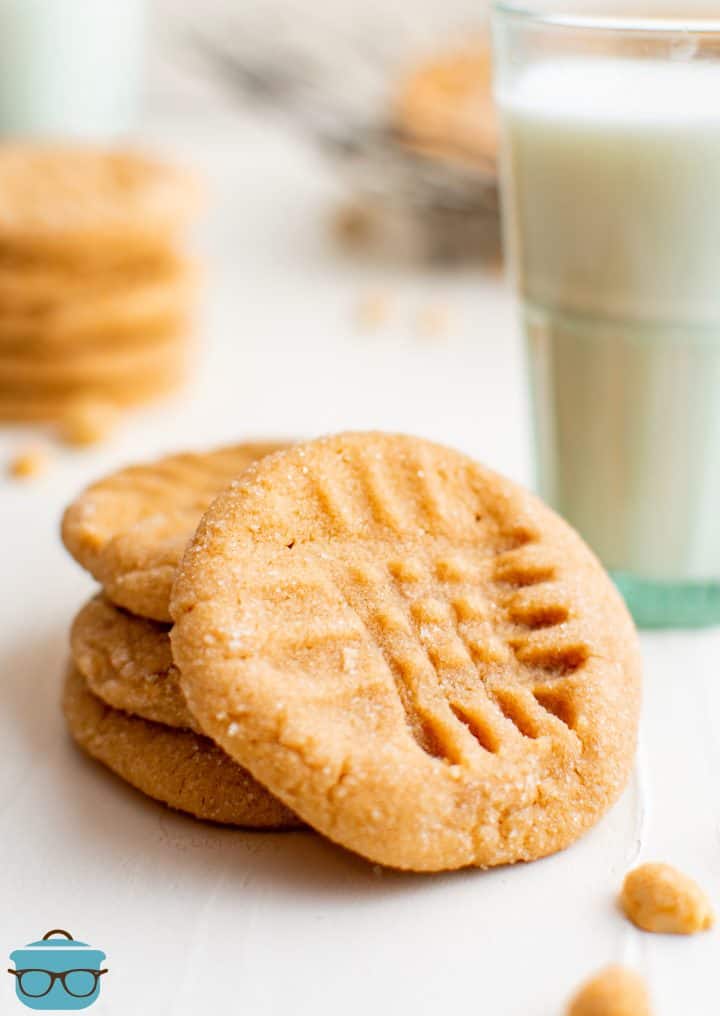 Stacked 3-Ingredient Peanut Butter Cookies with one leaning against stack.