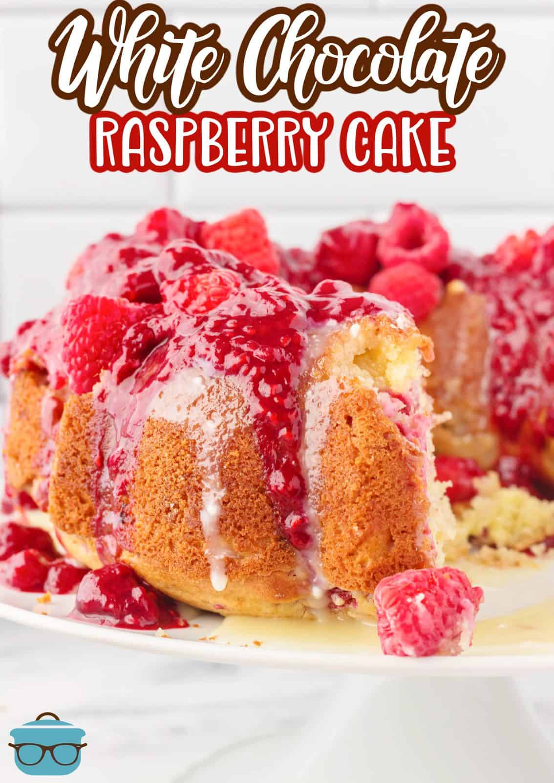 Pinterest image of White Chocolate Raspberry Cake with slies missing on platter.