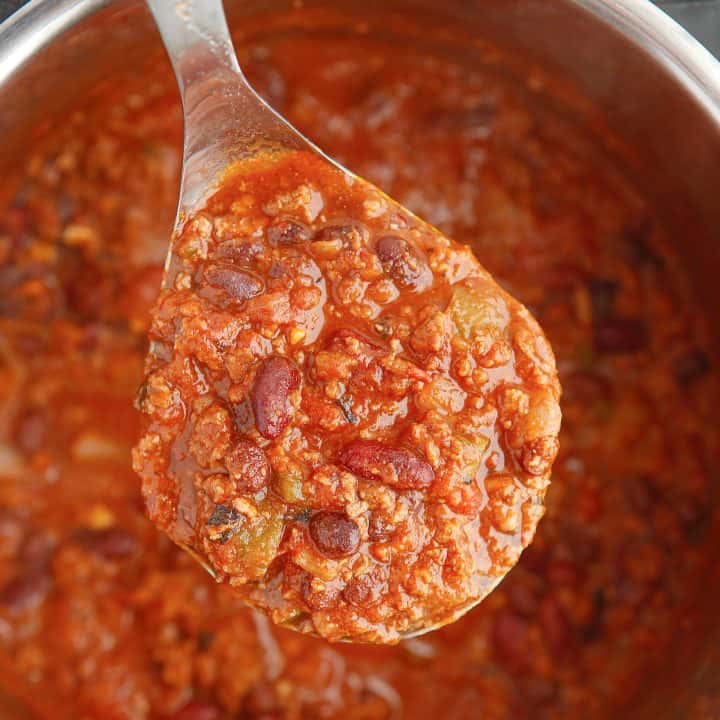 Square image of spoon holding Instant Pot Chili.