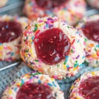 Square image of propped up Raspberry Thumbprint Cookies.