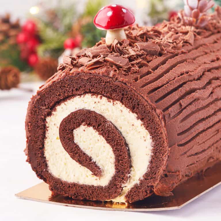 Square image close up of Christmas Yule Log Cake showing inside swirl.