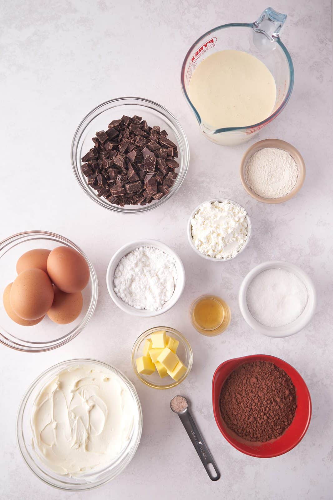 Ingredients needed: all-purpose flour, cornflour, cocoa powder, eggs, granulated sugar, salted butter, mascarpone cheese, powdered sugar, vanilla extract, heavy whipping cream and semi-sweet chocolate. 