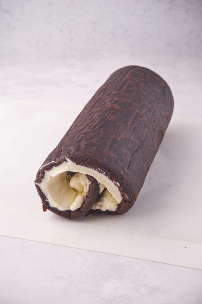 Cake rolled up with filling inside.