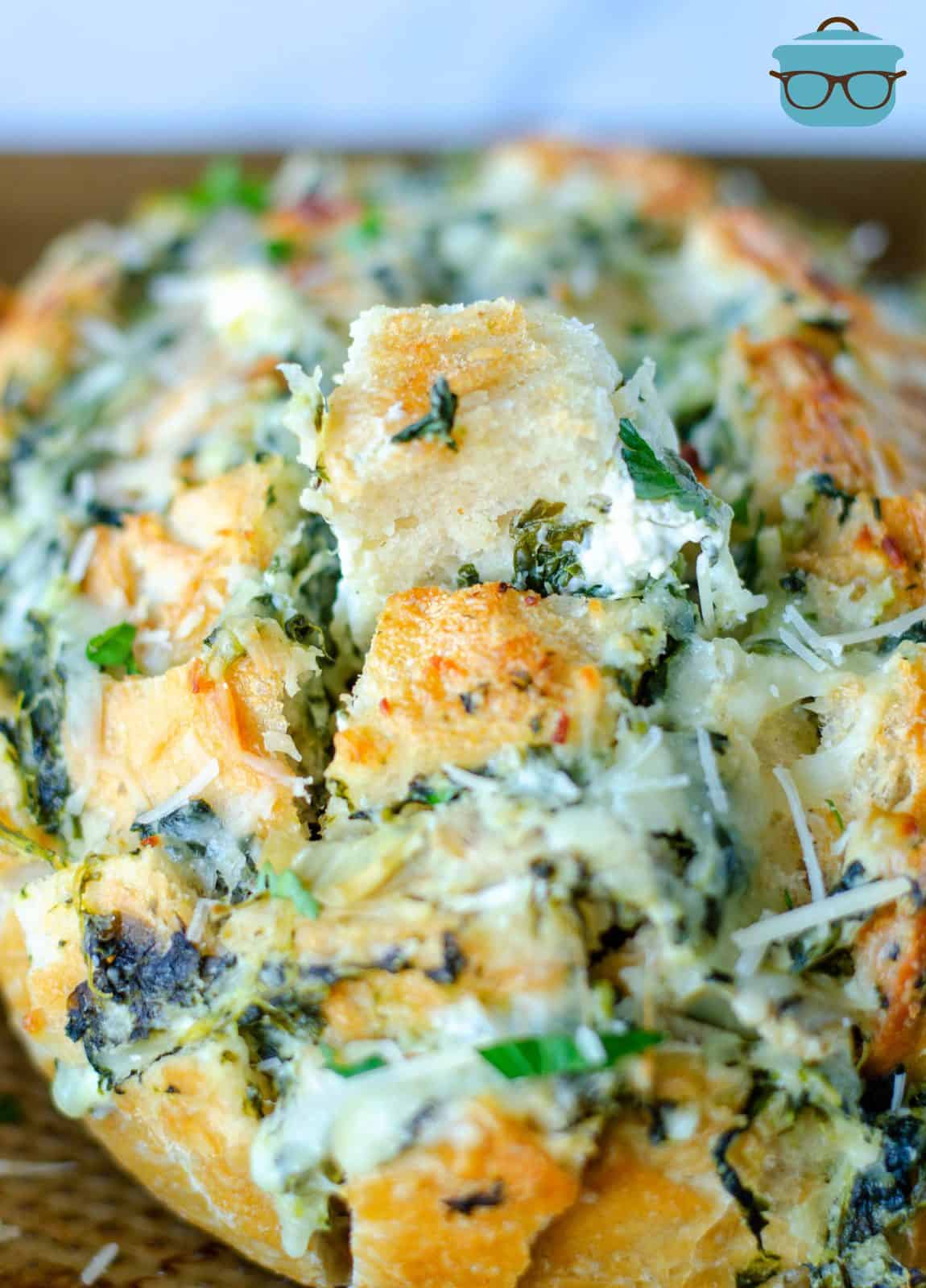 Close up of Spinach Artichoke Pull-Apart Bread showing melted cheese.