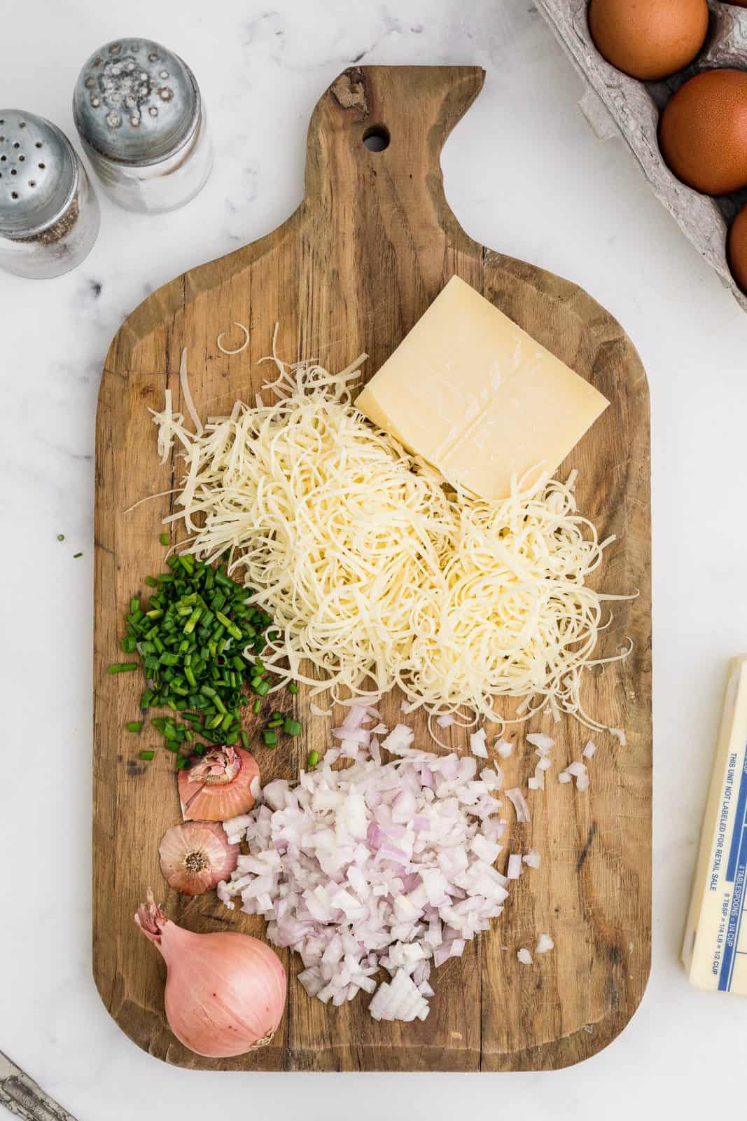 Chopped and grated cheese, chives and shallots.