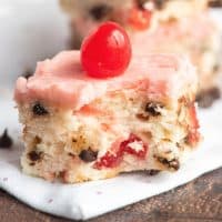 Square image of Cherry Chocolate Chip Bar with bite taken out.