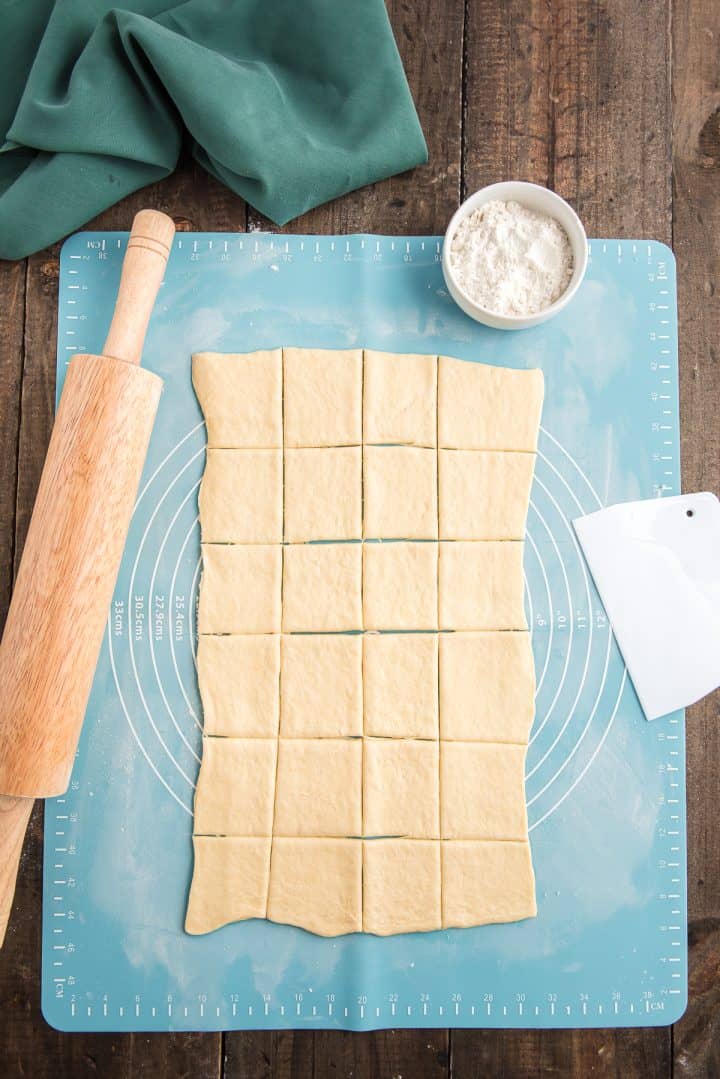 24 squares cut into crescent roll dough. 