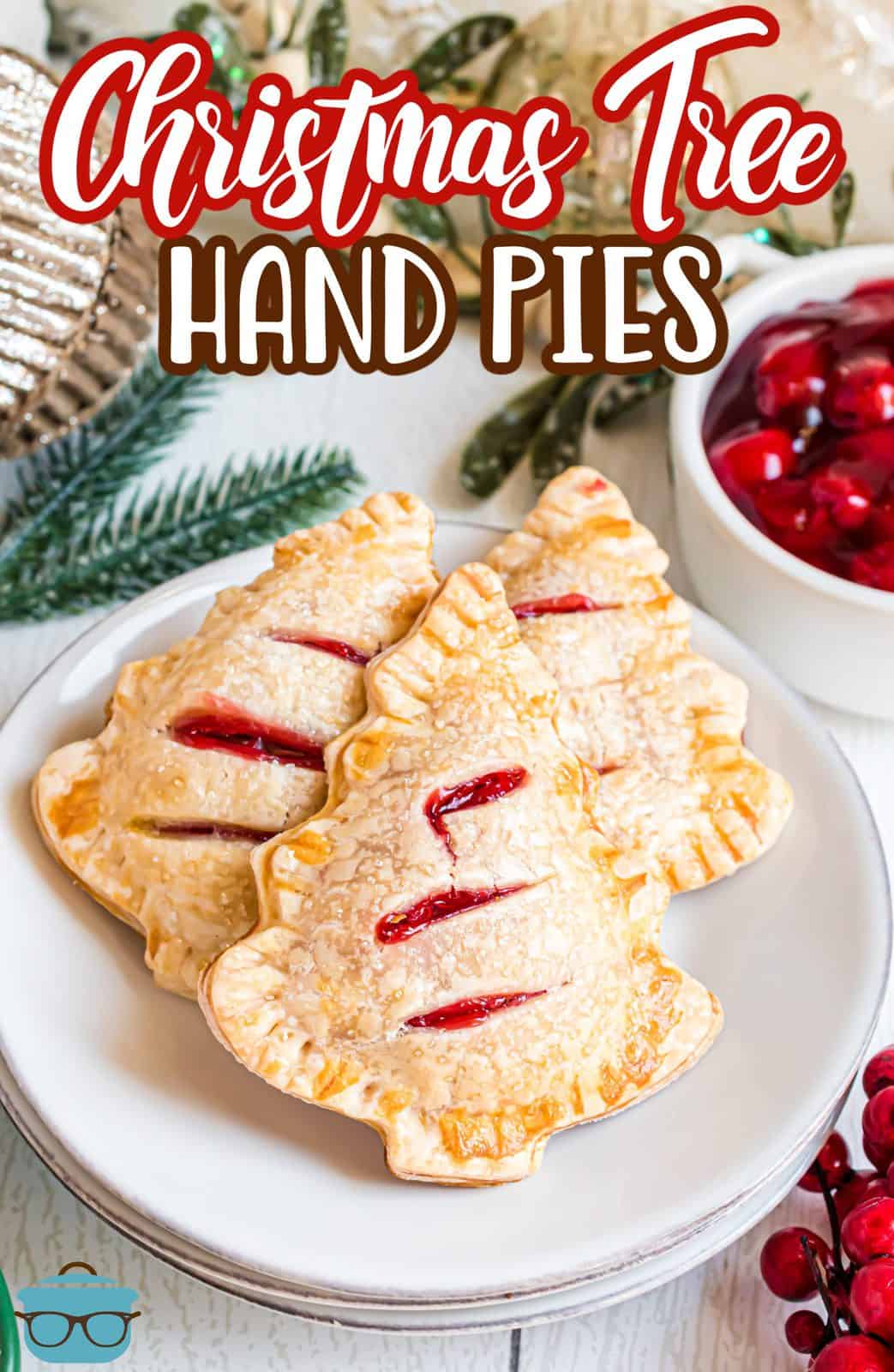 Pinterest image of three Christmas Tree Hand Pies on white plate.