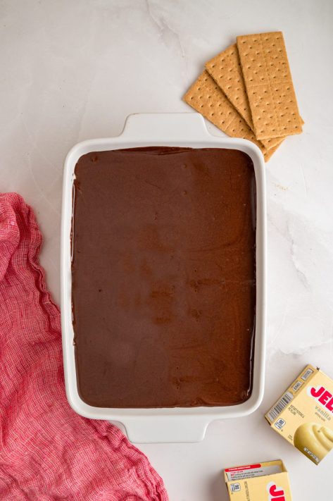 Frosting spread over a layered dessert.