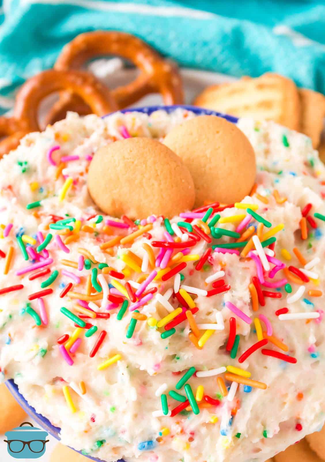Close up of Funfetti Cake batter Dip topped with two vanilla wafer cookies.