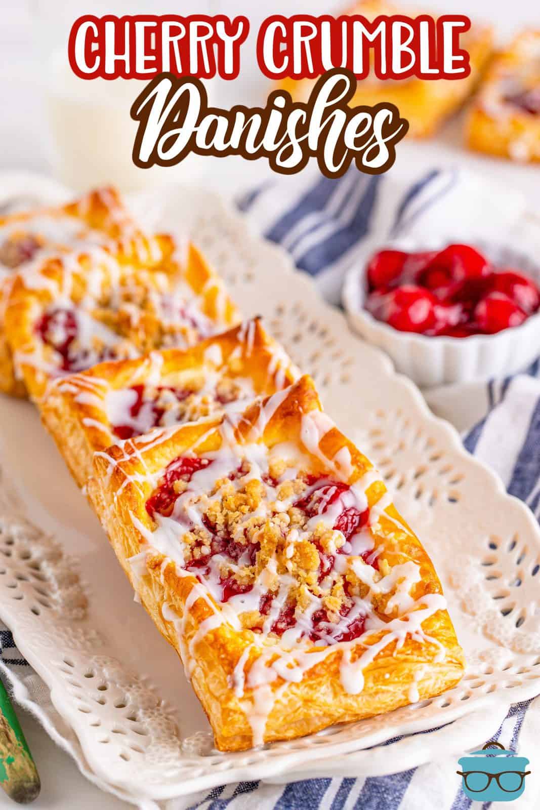 Pinterest image of layered Cherry Crumble Danishes on white plater.