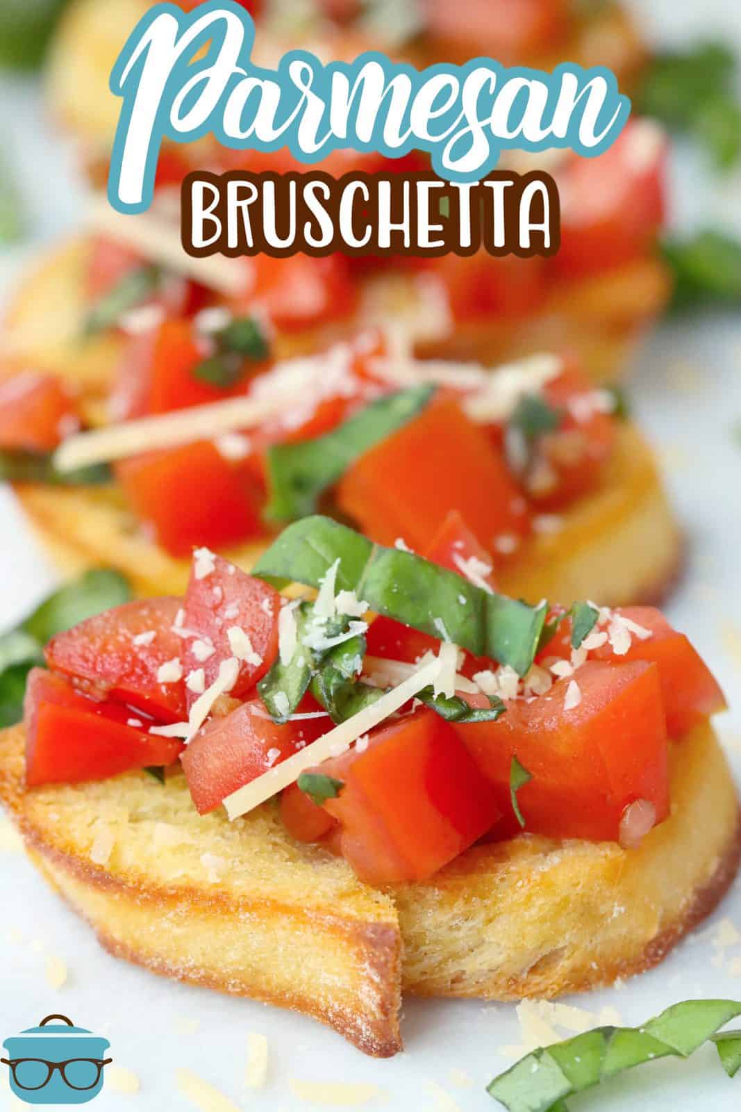 Pinterest image of Parmesan Bruschetta on baguette slices lined up on white platter.