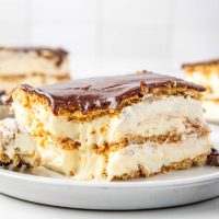 Eclair Cake A slice of Eclair Cake sitting on a plate with a bite missing.