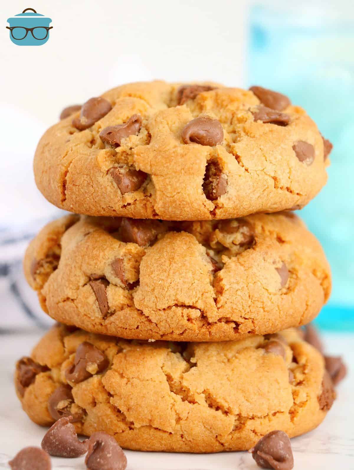 Three stacked Big, Fat, Chewy Chocolate Chip Cookies on top of one another.