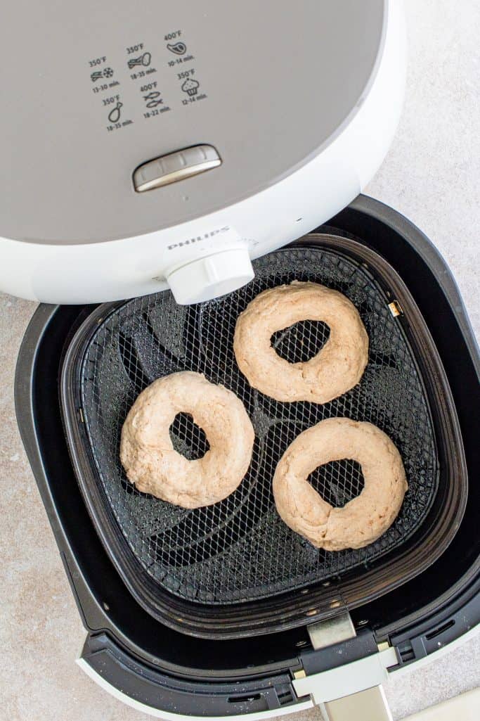 Bagels placed in air fryer.