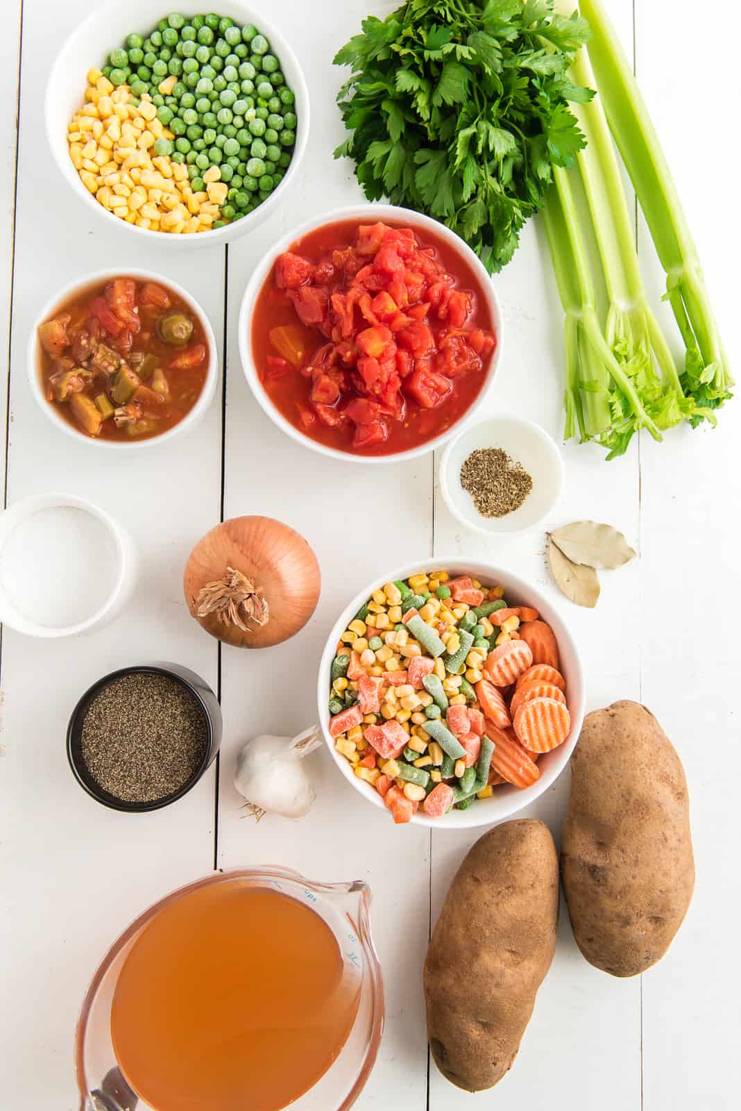 Ingredients needed: onion, celery, olive oil, garlic, frozen mixed vegetables, frozen sliced carrots, frozen peas, frozen corn, diced tomatoes, tomatoes and okra, vegetable broth, potato, bay leaves, salt, pepper, dried basil, dried oregano and parsley..