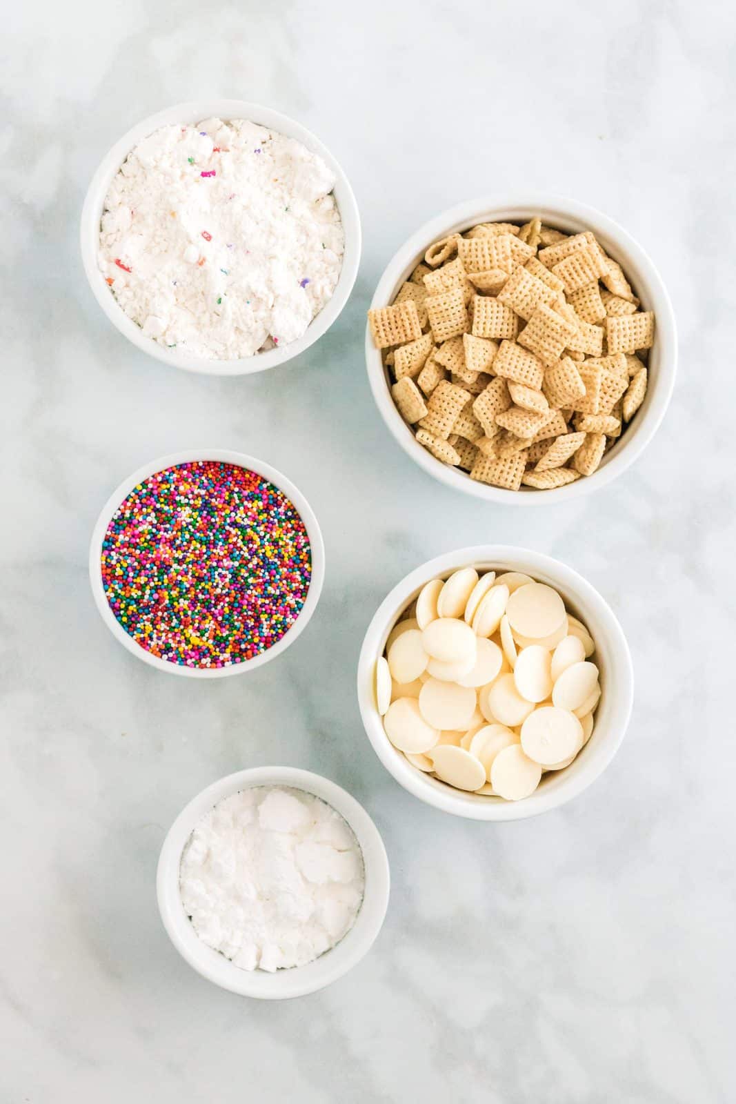 Ingredients needed: rice chex cereal, white candy melts, sprinkles, funfetti cake mix and powdered sugar.