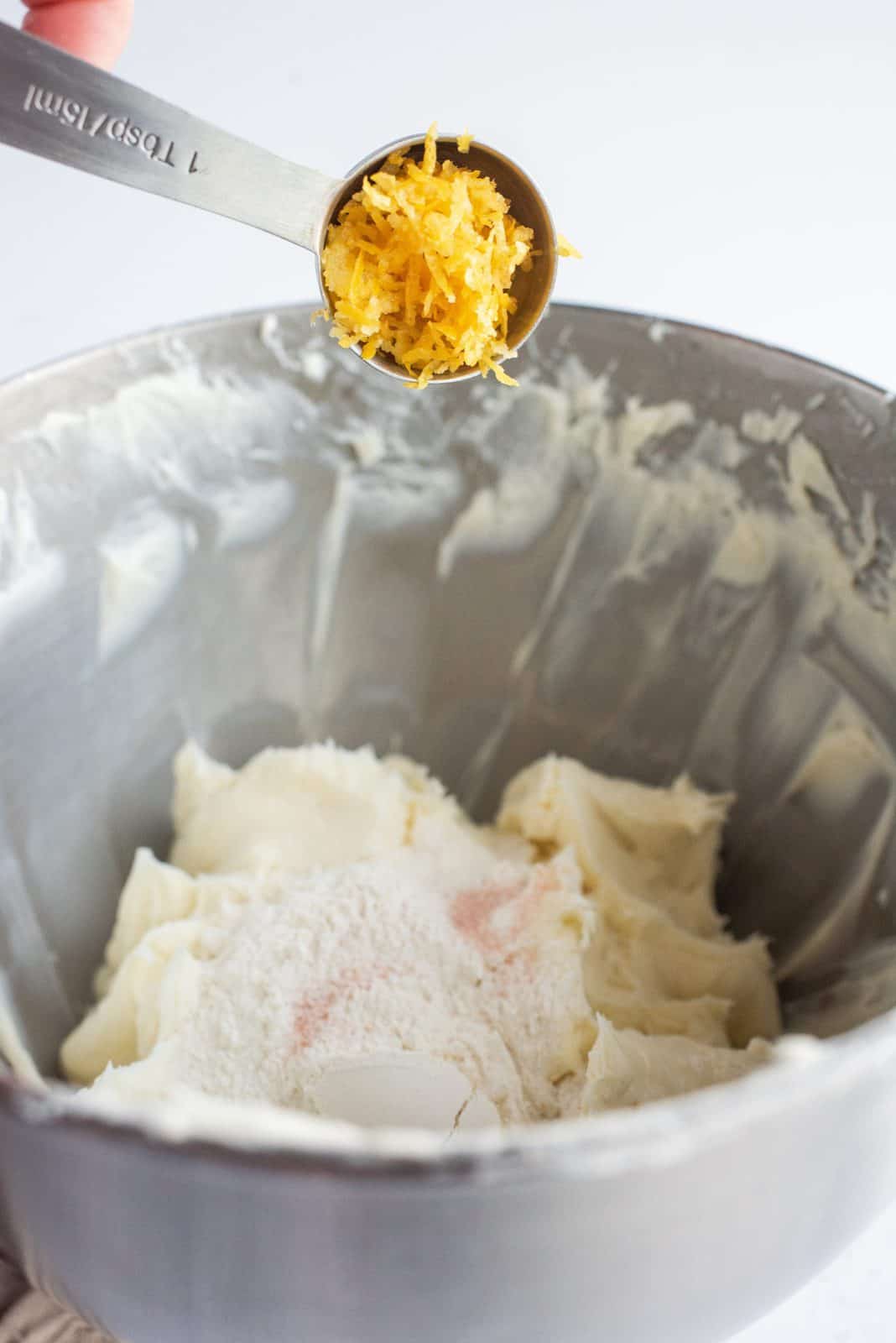 Flour, salt, and lemon zest added to cream cheese mixture.