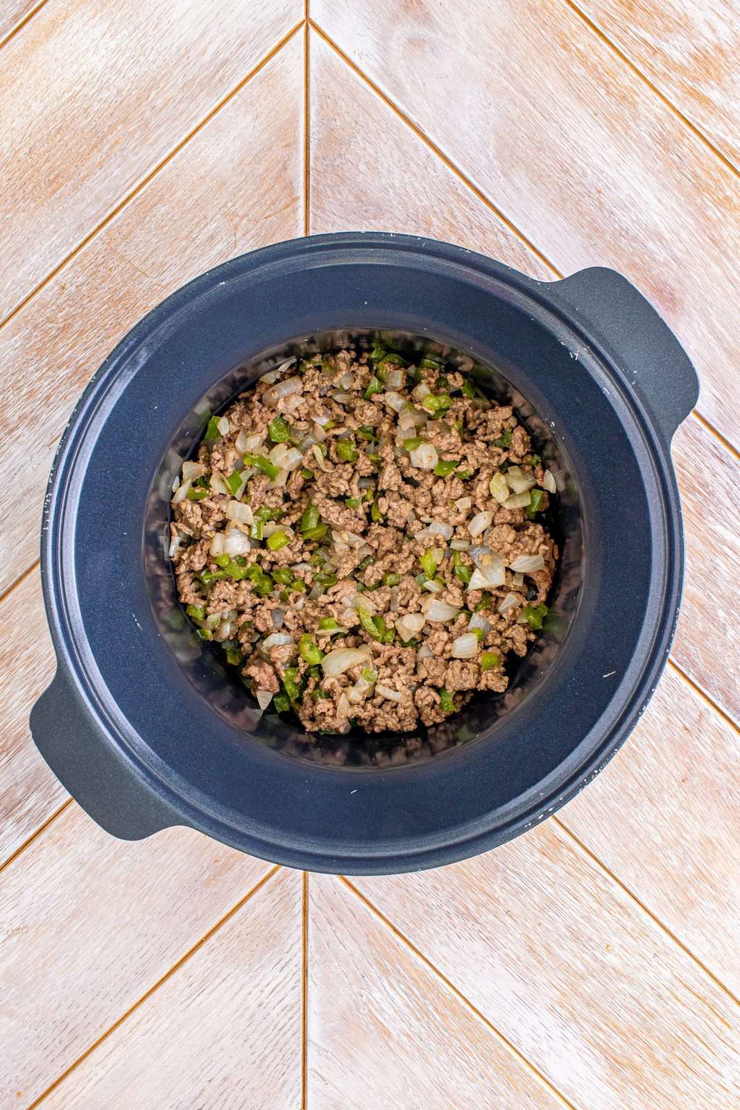 Ground beef mixture added to bottom of crock pot.