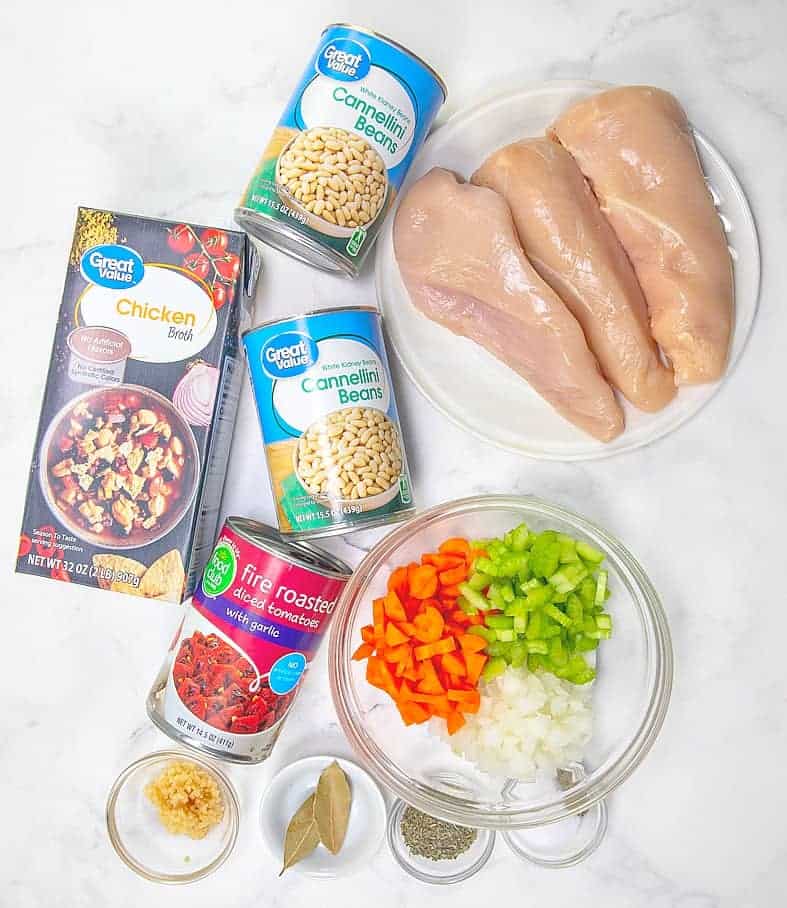 chicken breasts, diced celery, onion, carrots, chicken stock, cannellini beans, diced tomatoes, garlic, Italian seasoning, bay leaves and heavy cream.