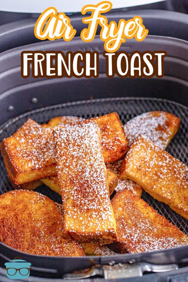 fully baked French toast sticks shown in an air fryer basket.