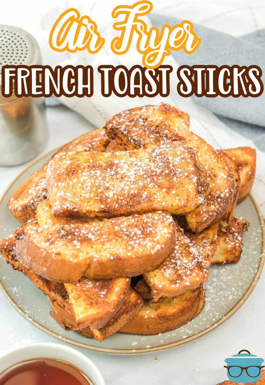 Pinterest image of stacked Air Fryer French Toast Sticks on plate with powdered sugar.