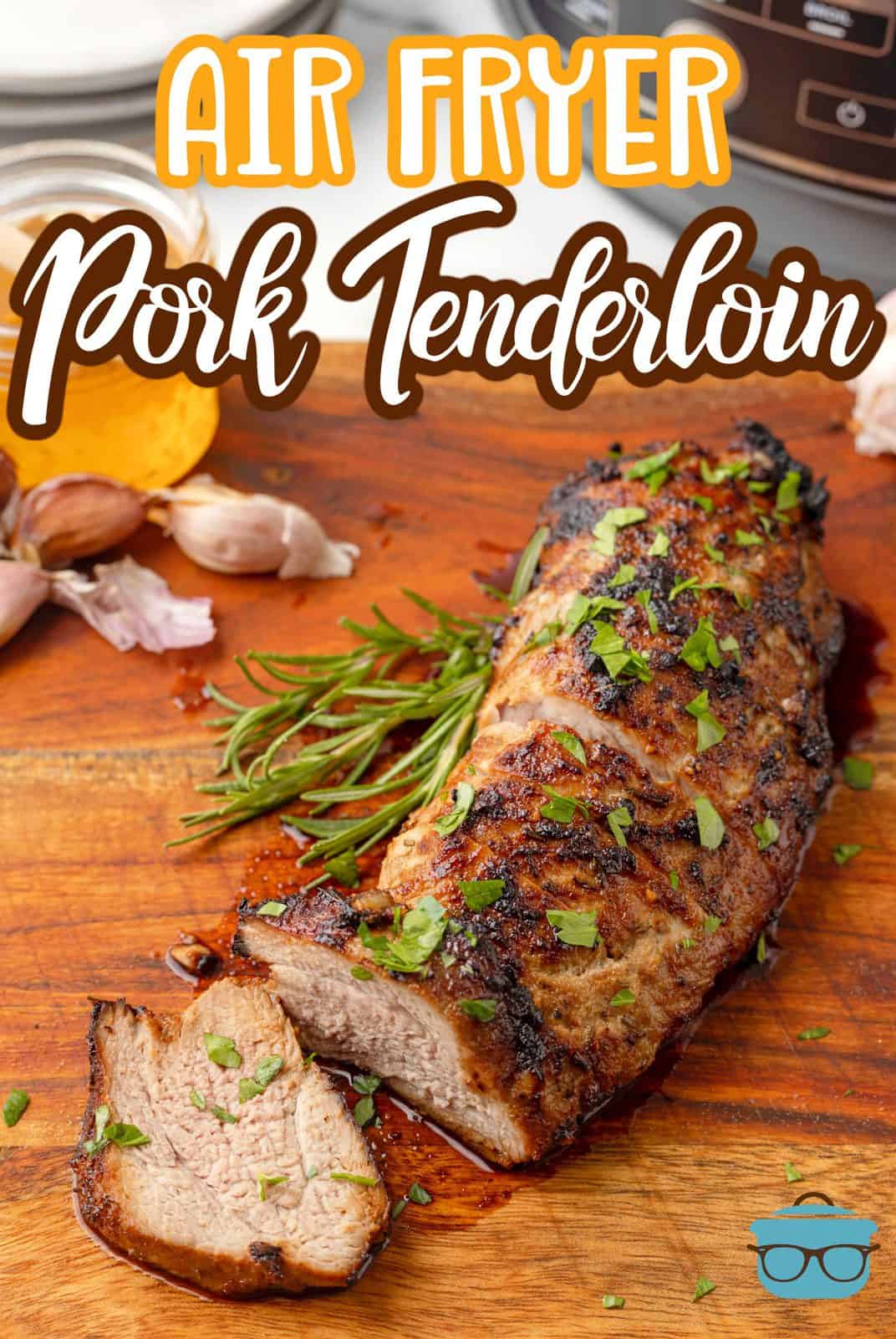 Pinterest image of Air Fryer Pork Tenderloin with a few slices cut off.