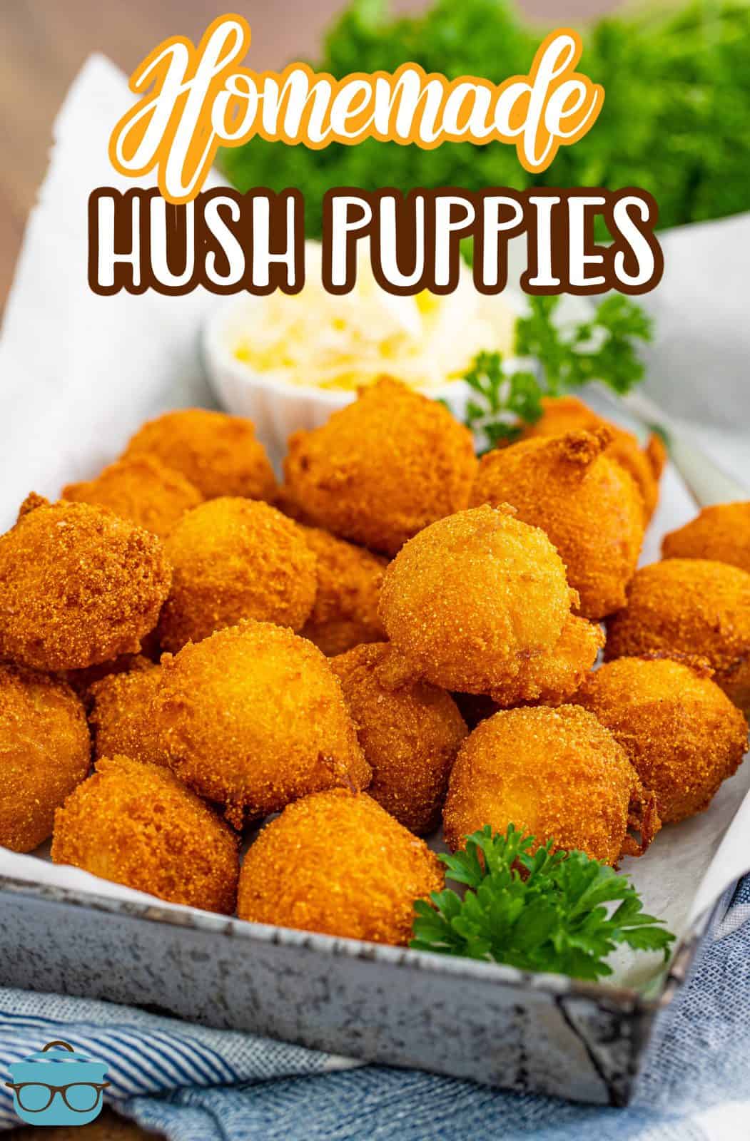 Pinterest image of Homemade Hush Puppies on metal tray with parsley garnish.
