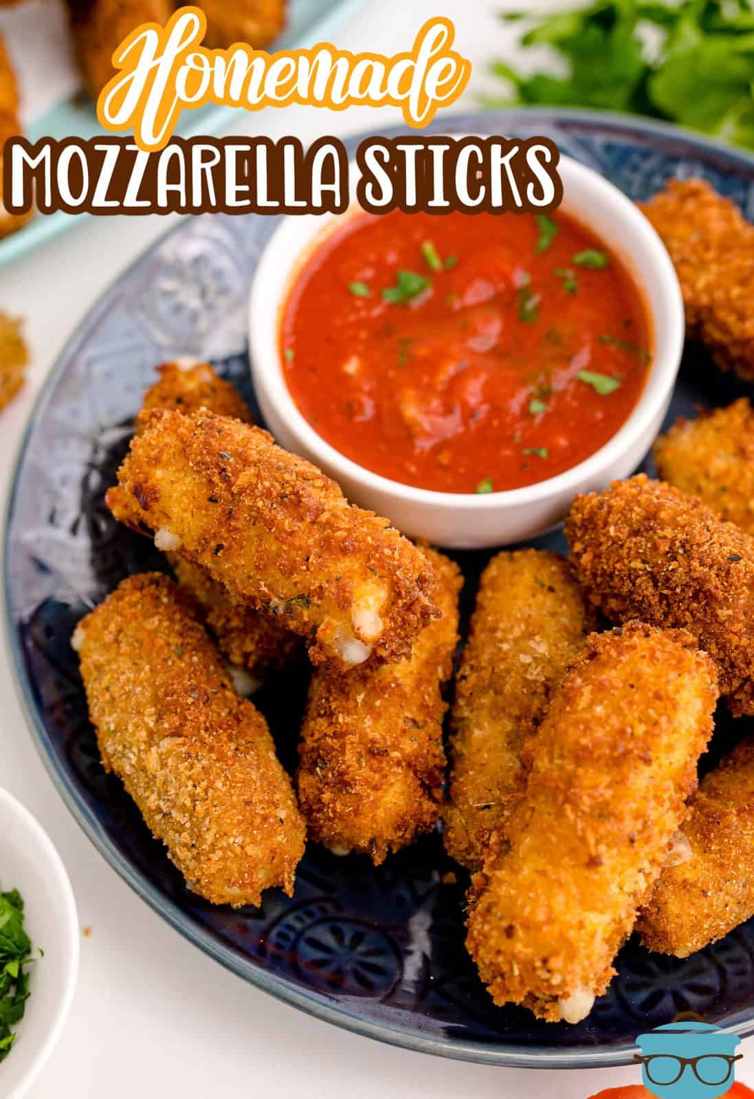Pinterest image of stacked Homemade Mozzarella Sticks on black plate with sauce.
