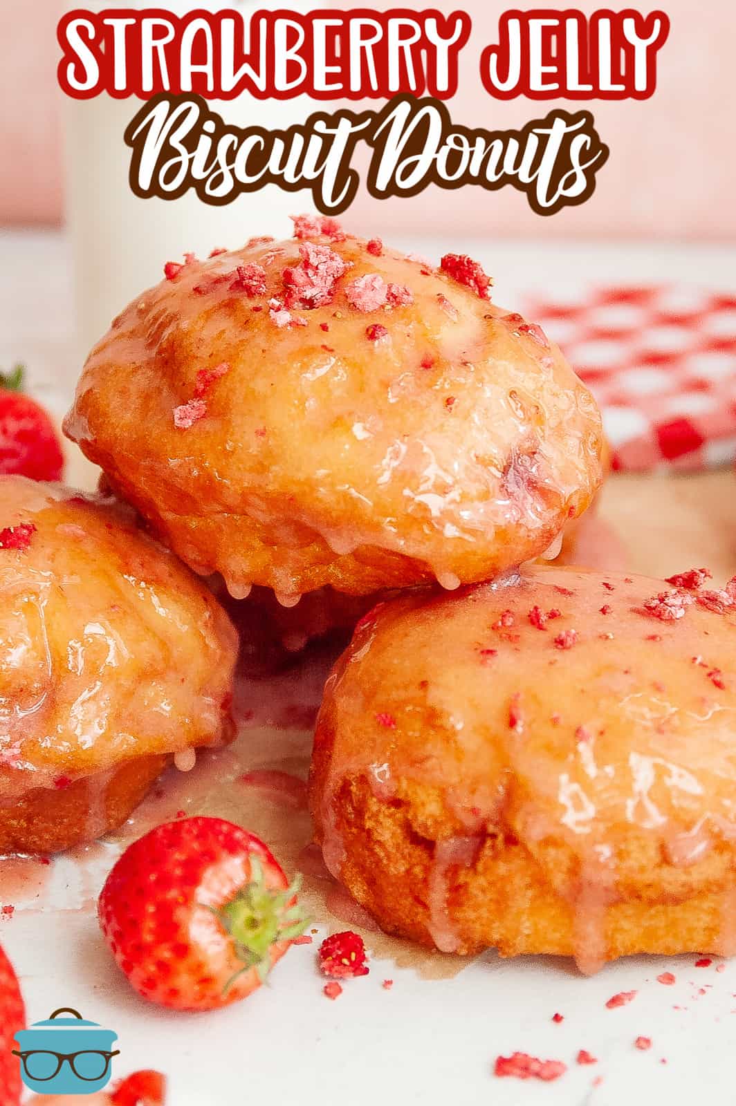 Pinterest image of Strawberry Jelly Filled Biscuit Donuts on plate.