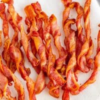 Square image of Air Fryer Twisted Bacon on plate.