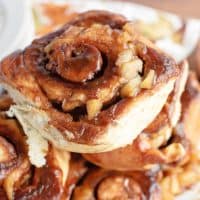 Square image close up of stacked Apple Cinnamon Buns.