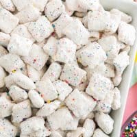 Square image of Funfetti Puppy Chow in dish close up.