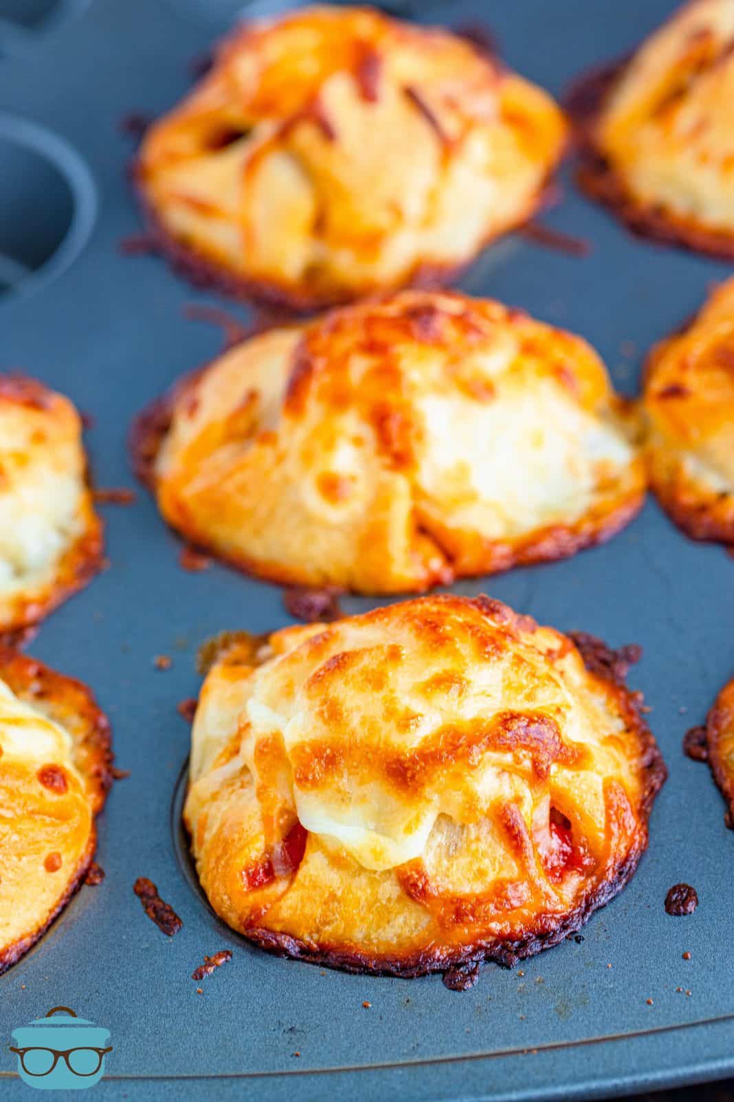 Meatball Sub Cups in muffin tin right out of oven.