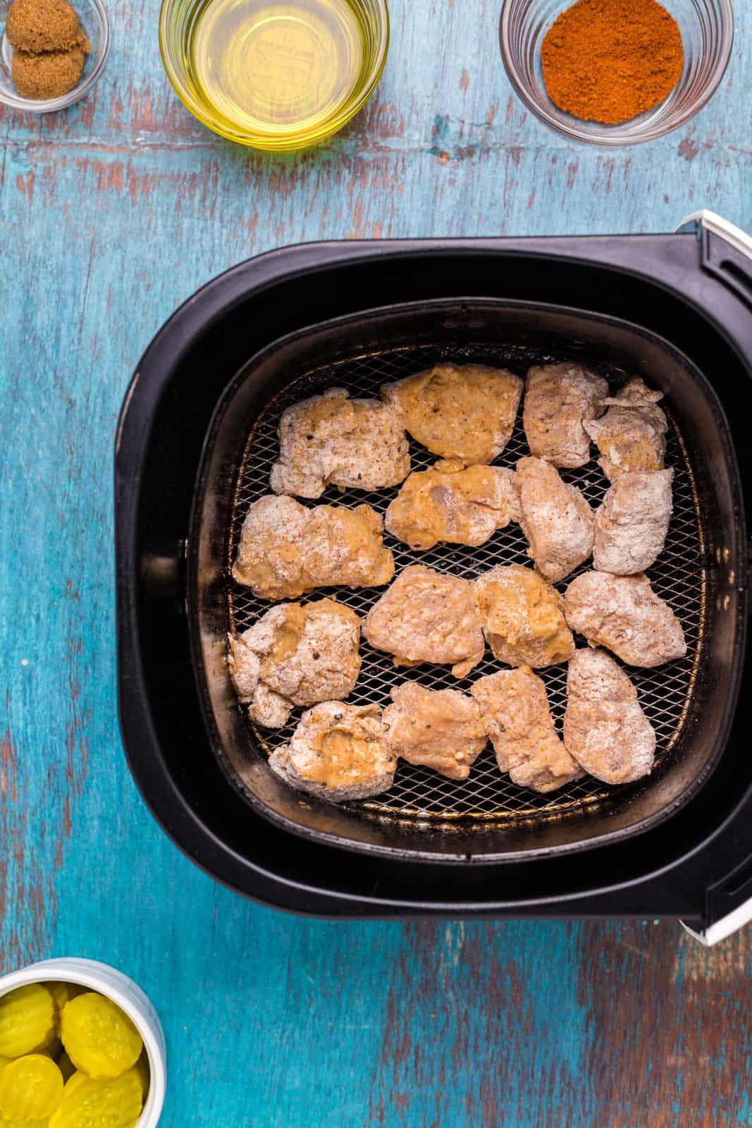 Chicken nuggets added to air fryer.