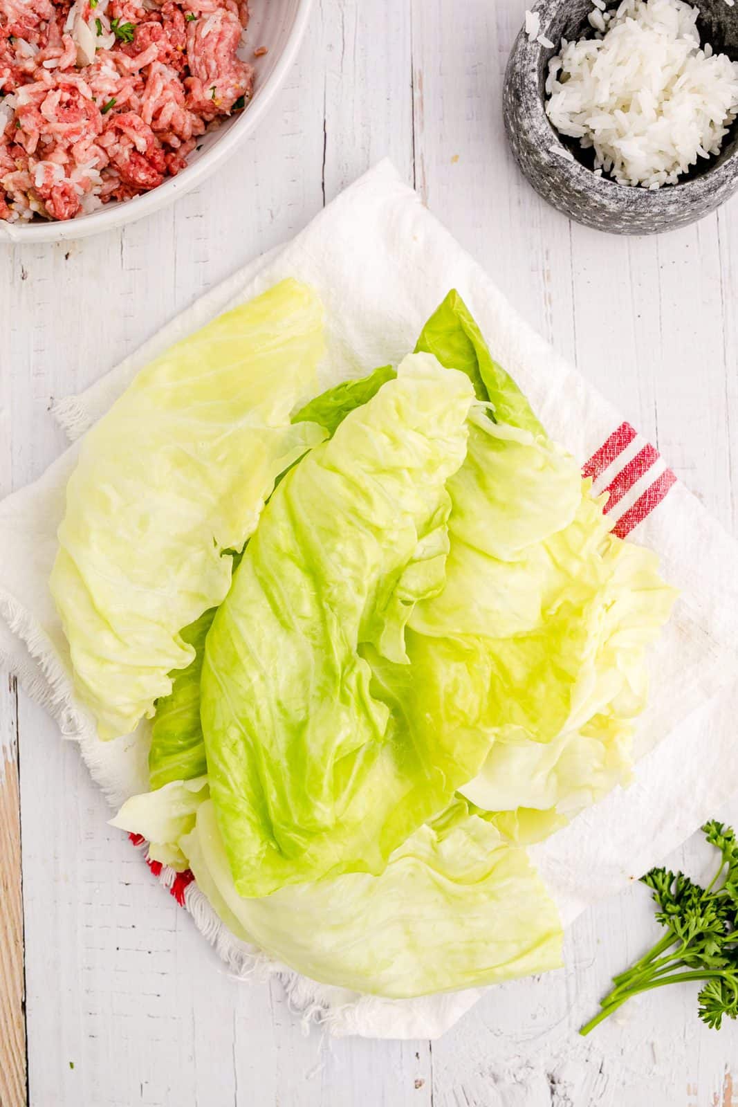 Cabbage leaves being dried on paper towel.