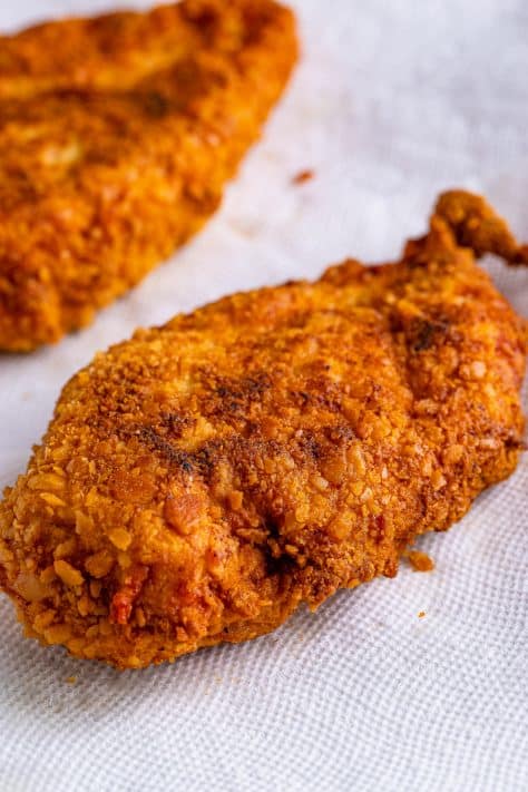Fried chicken on paper towels.