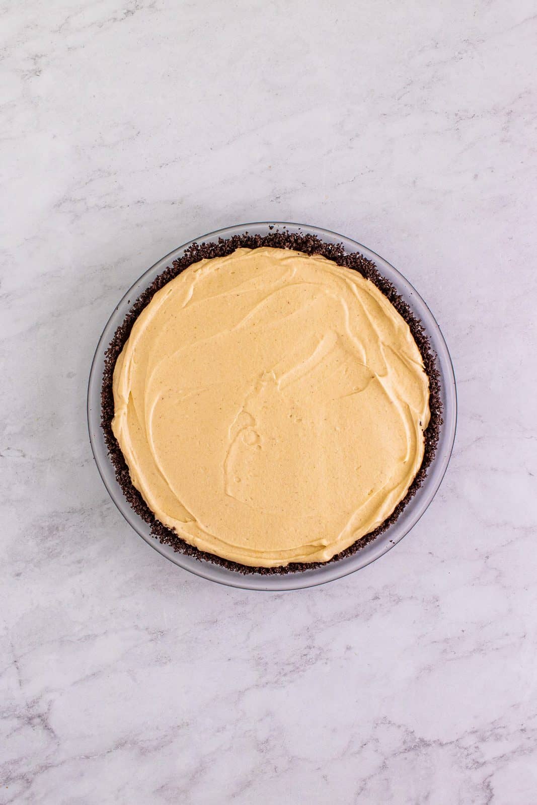 Peanut butter filling added to pie crust.