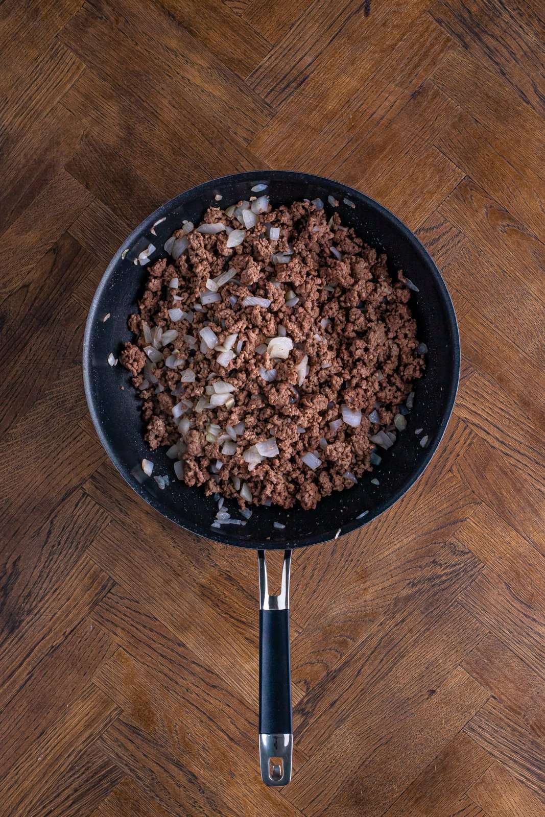 ground beef and onion cooked in a large skillet. 