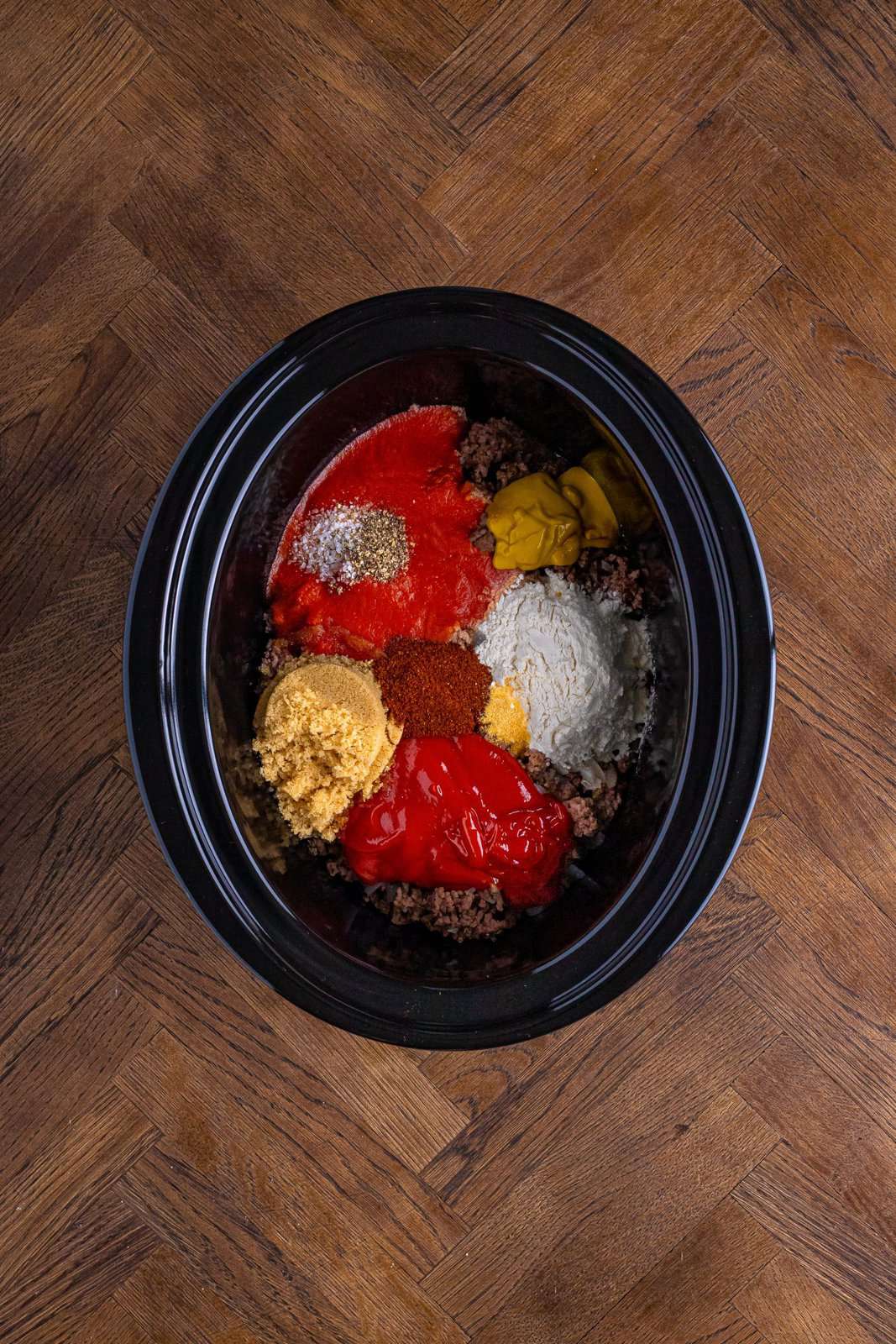 all ingredients added into a large, oval slow cooker. 