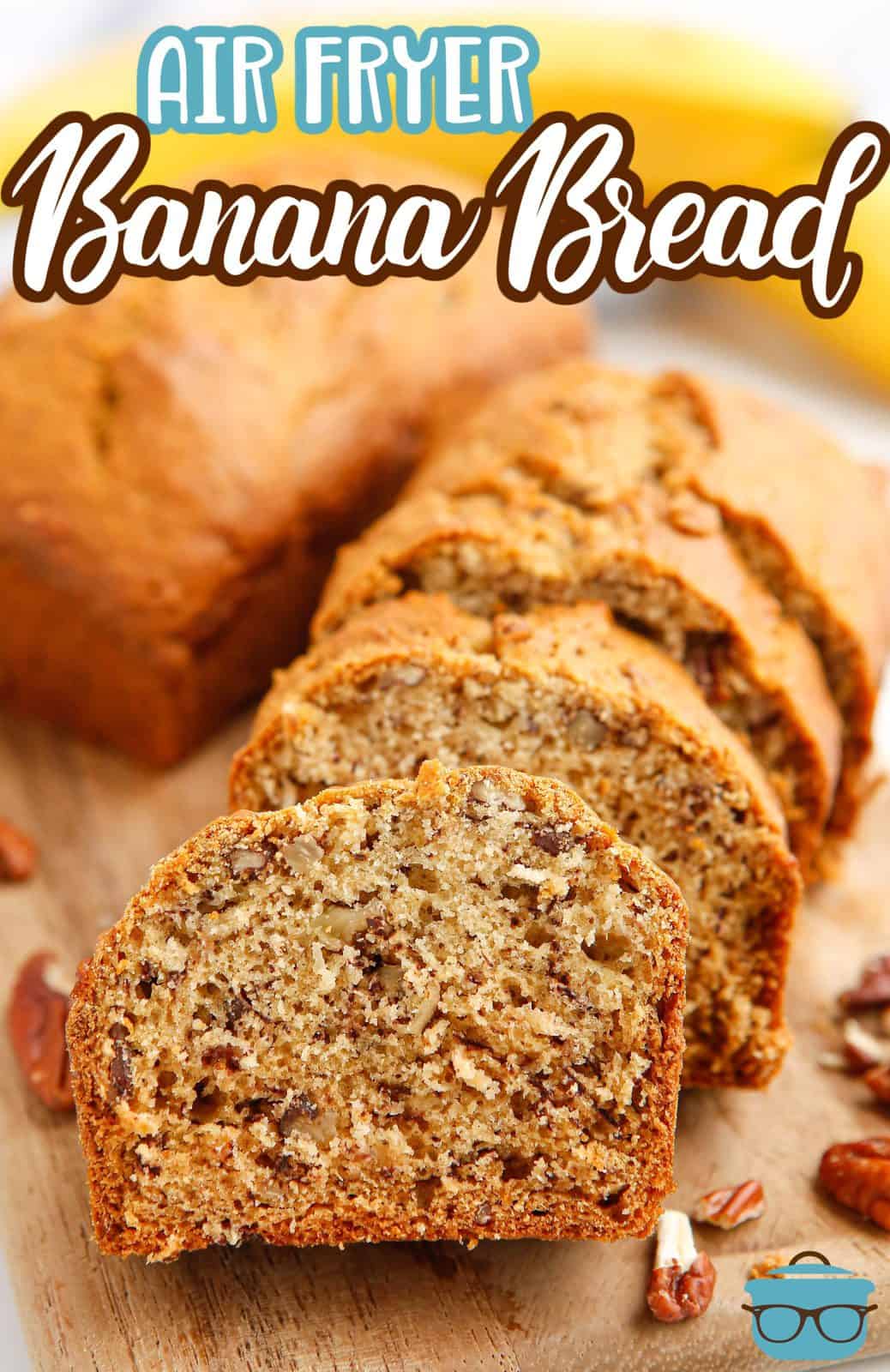 Pinterest image of sliced Air Fryer Banana Bread laying up against one another on wooden board.