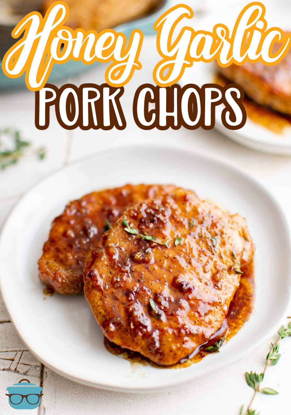 Two Honey Garlic Pork Chops on plate with glaze Pinterest image.