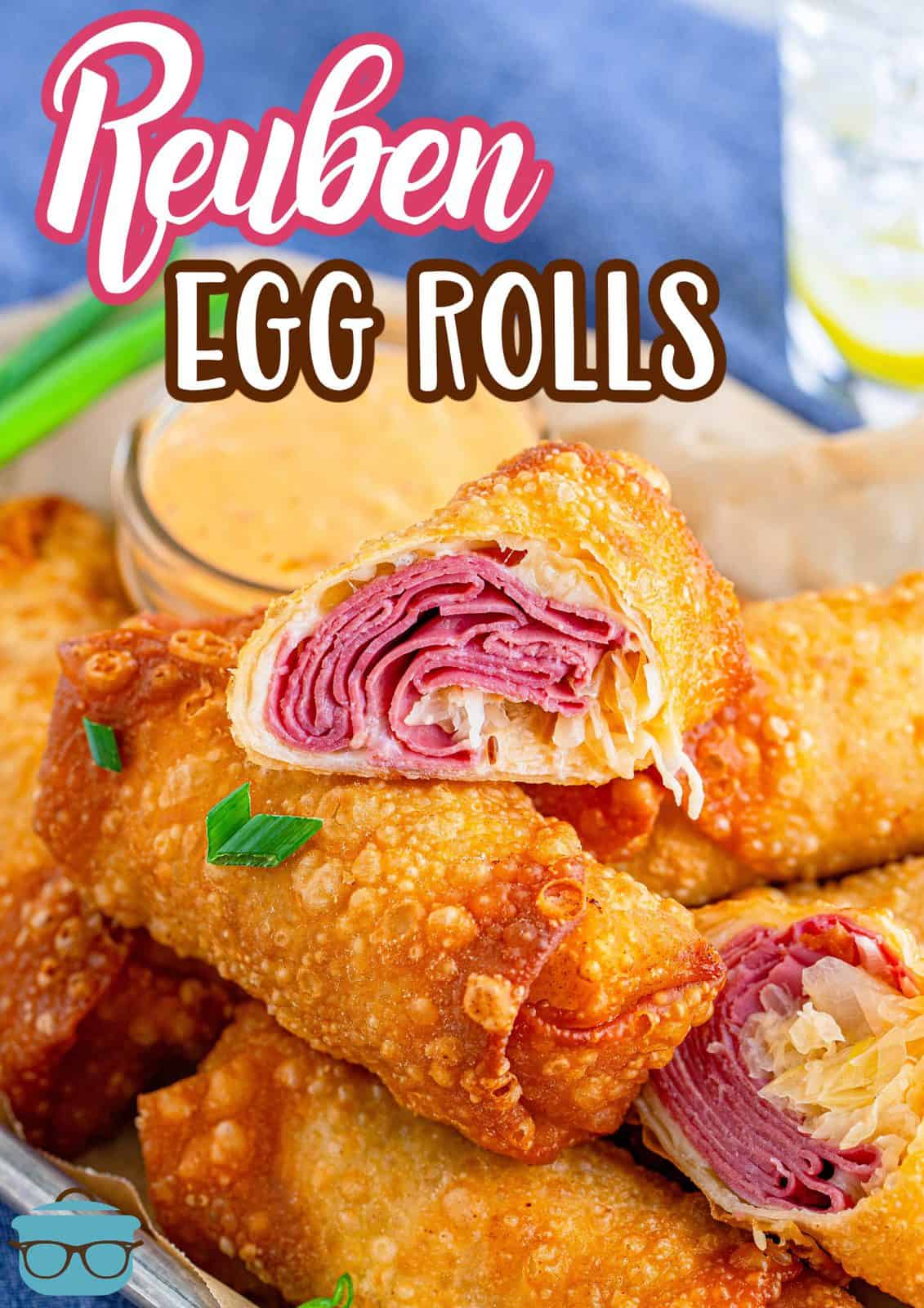 Pinterest image of stacked Reuben Egg Rolls with top one cut in half.