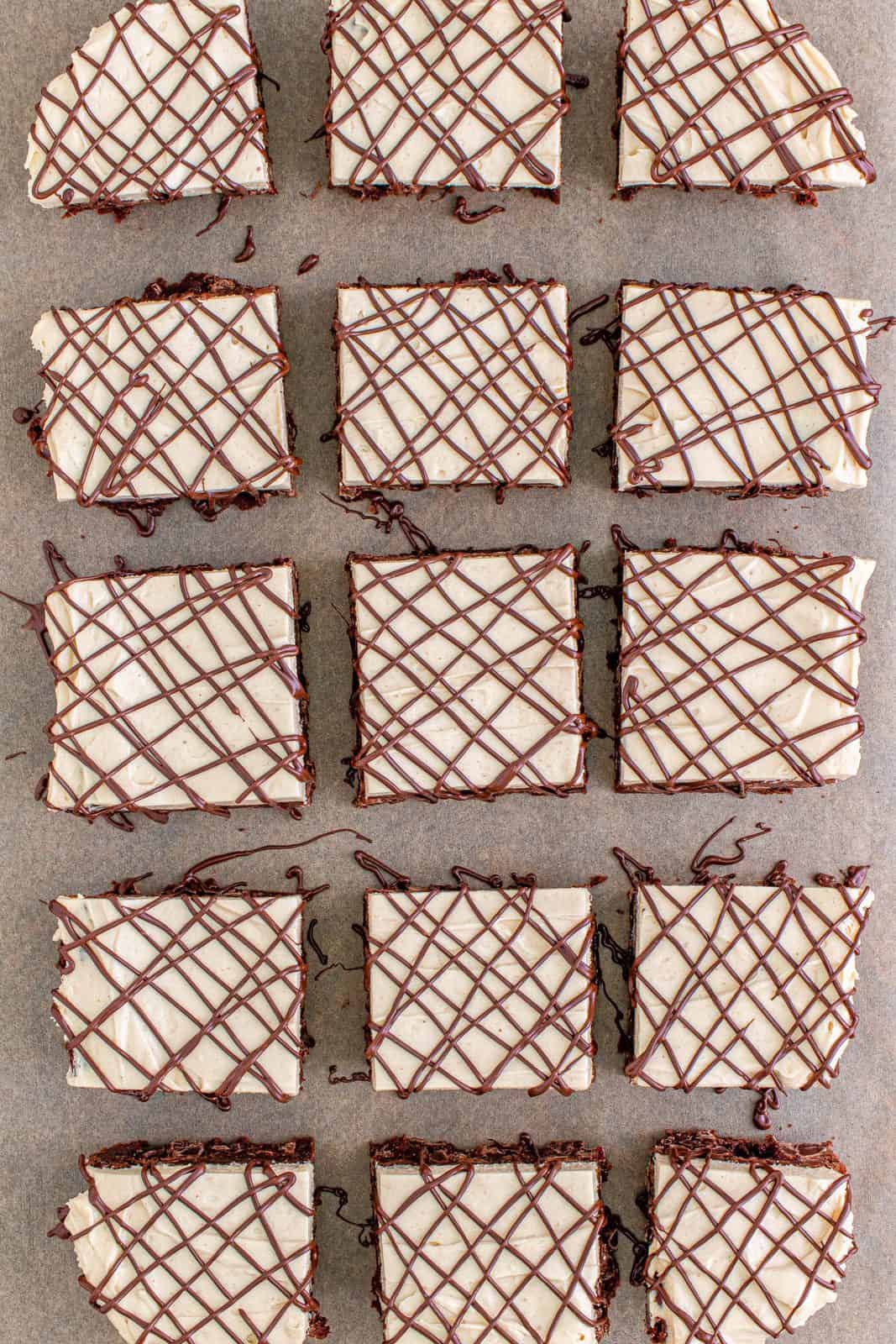 Brownie cut and drizzled with chocolate.