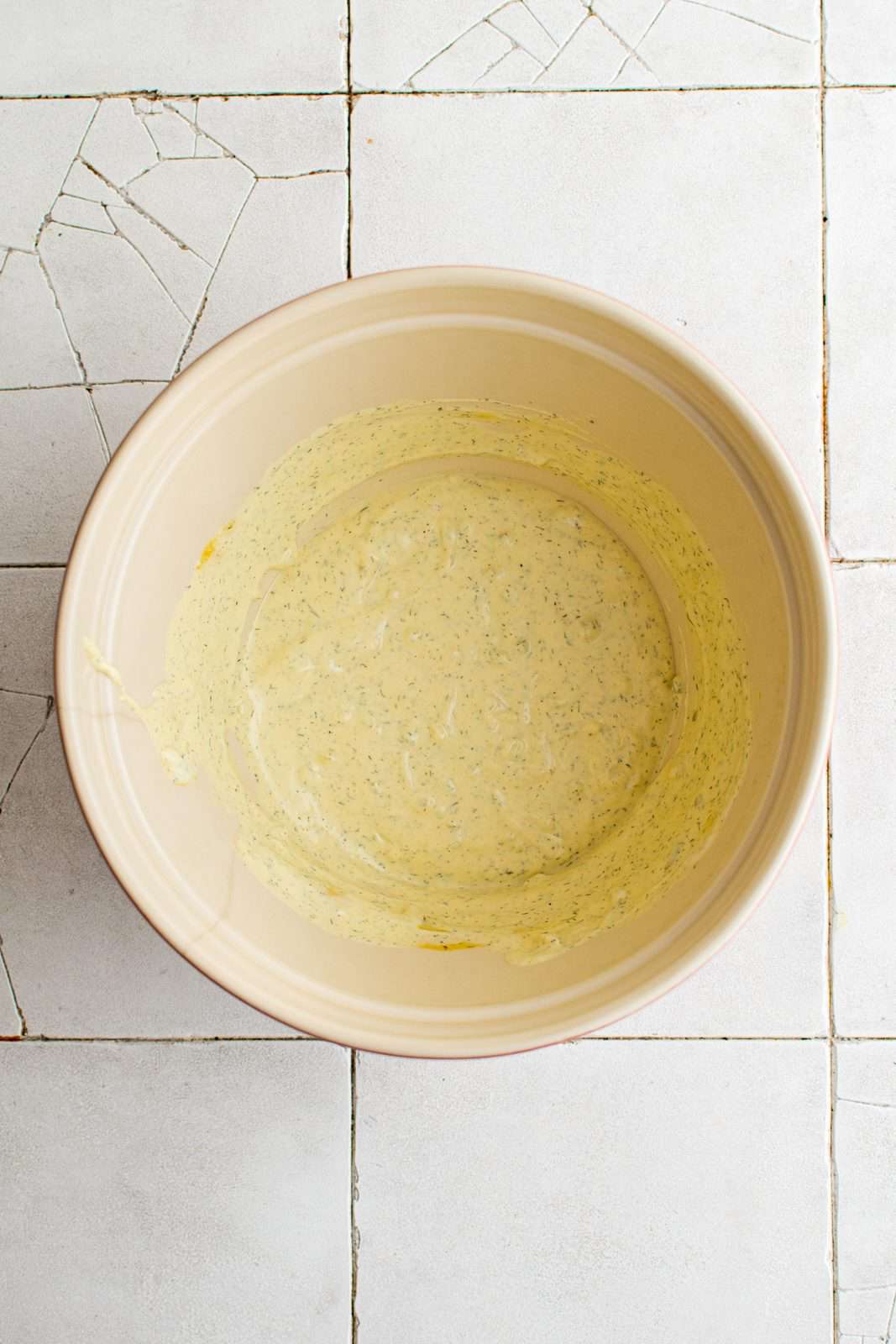 Mayonnaise, mustard, pickle relish, dill, salt and pepper stirred together in large bowl.