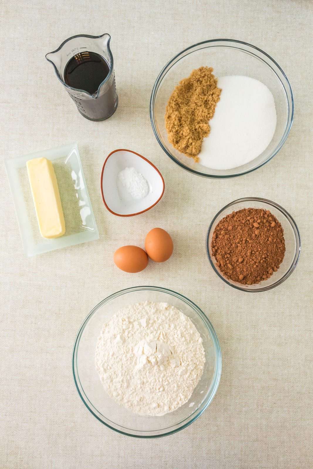 all-purpose flour, salt, baking soda, cocoa powder, Coca Cola, salted butter, granulated sugar, light brown sugar, eggs and powdered sugar.